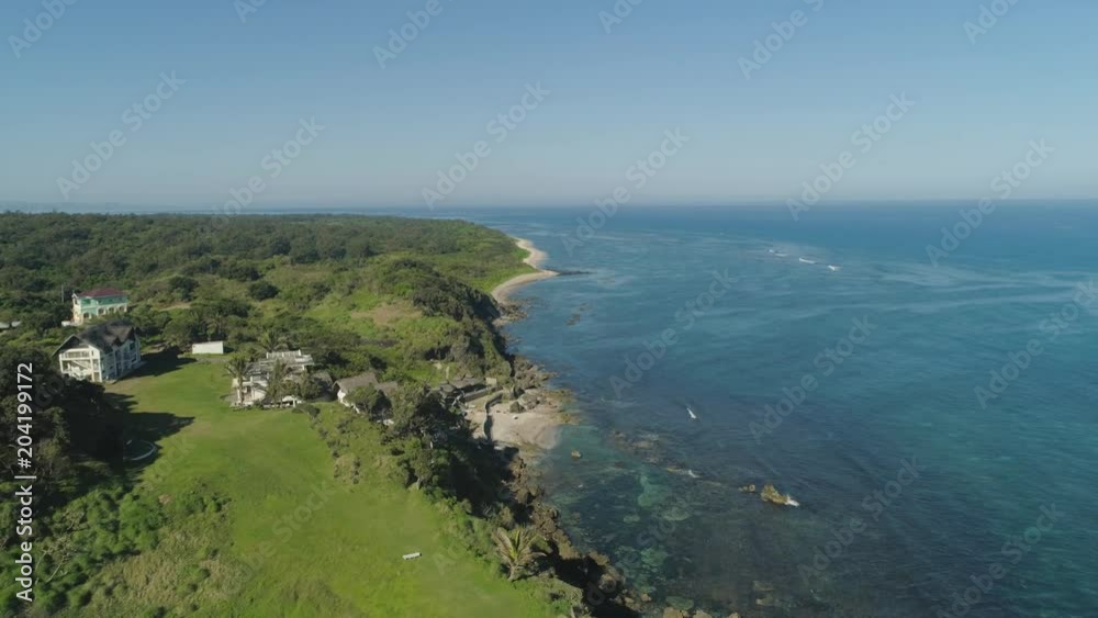 Aerial view of seashore with beach, lagoons and coral reefs. Philippines, Luzon. Ocean coastline with turquoise water. Tropical landscape in Asia. Aerial view of seashore with beach, lagoons and coral reefs. Philippines, Luzon. Ocean coastline with turquoise water. Tropical landscape in Asia.