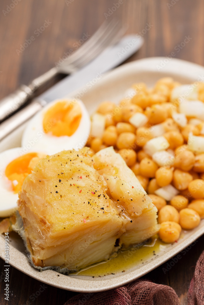cod fish with chick pea and boiled egg on dish cod fish with chick pea and boiled egg on dish