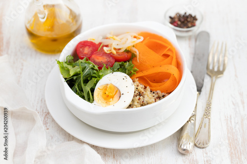vegetables with boiled egg in white bowl