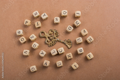 Letter cubes of made of wood around key photo