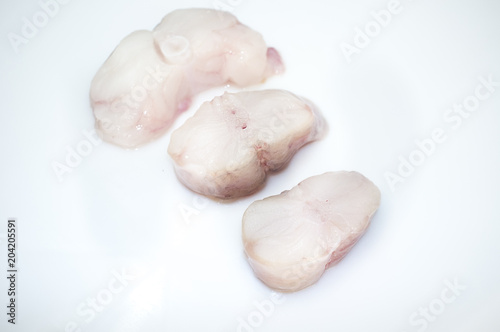Monkfish tail steaks. Isolated over white