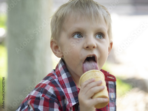 boy licks ice cream