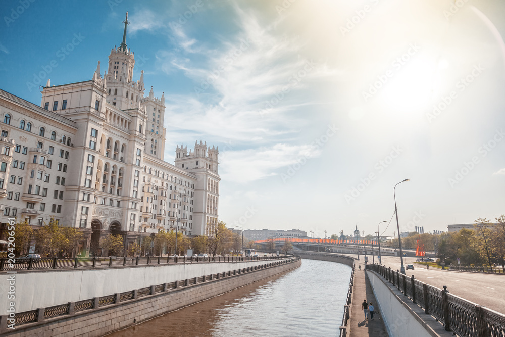 Beautiful city summer landscape, the capital of Russia Moscow, the embankment of the river in the city center, view of the skyscraper on Kotelnicheskaya