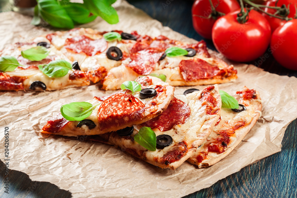 Slices of pizza pepperoni with olives Slices of pizza pepperoni with olives