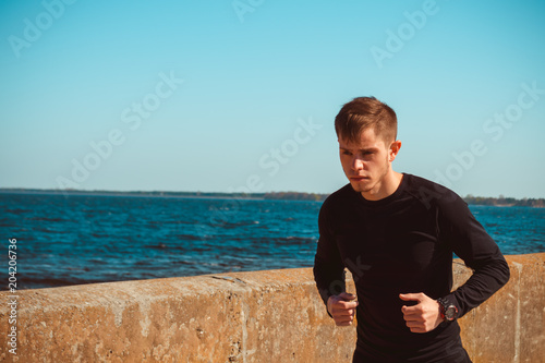 Healthy young black man jogging
