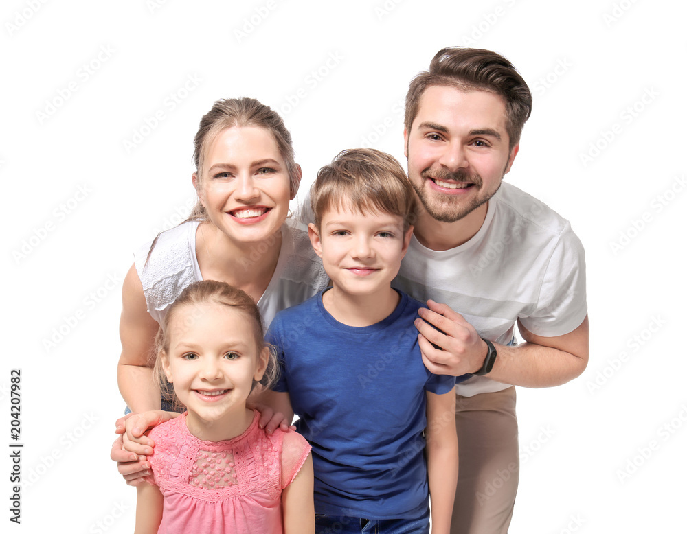 Portrait of couple with children on white background. Happy family