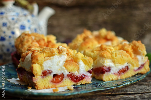 Square pieces of plum cake with crumble