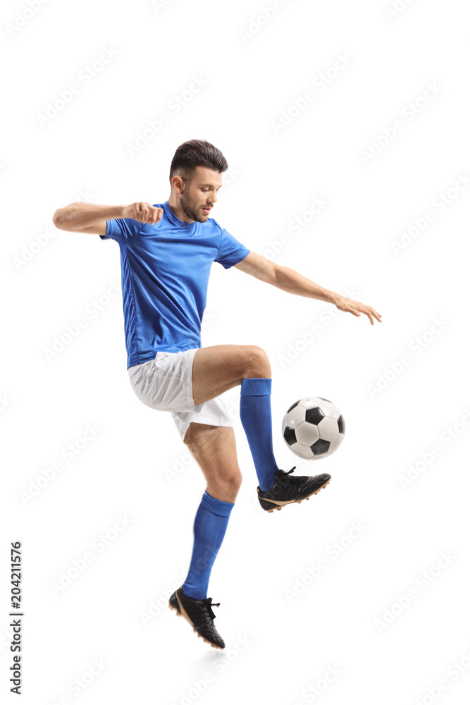 Naklejka premium Soccer player juggling