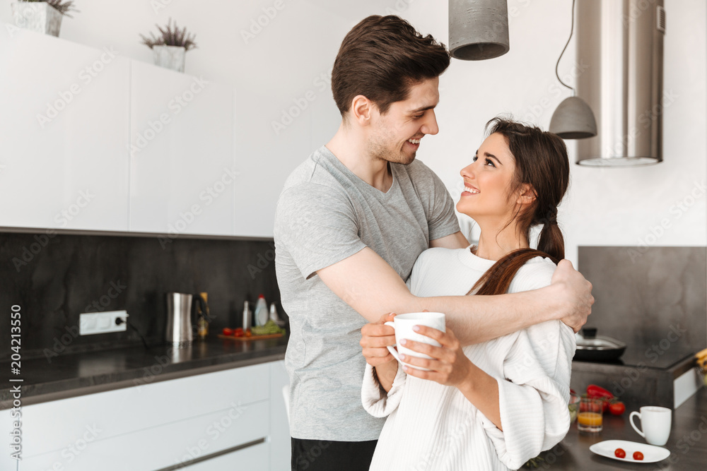 Portrait of a pretty young couple drinking coffee Portrait of a pretty young couple drinking coffee