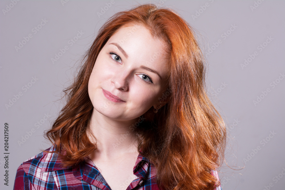 Close-up of a smiling portrait of a beautiful young woman Close-up of a smiling portrait of a beautiful young woman
