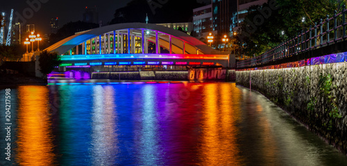 Rainbow colors light the Elgin Bridge in downtown Singapore © Rex Wholster
