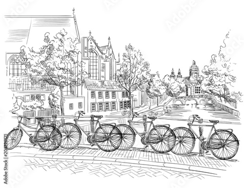 Bicycles on bridge over the canals of Amsterdam, Netherlands