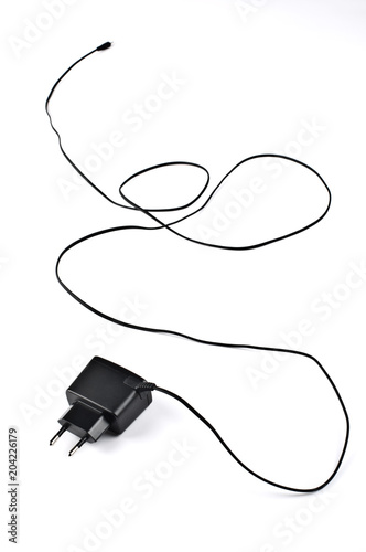 Mobile phone battery charger on white background.