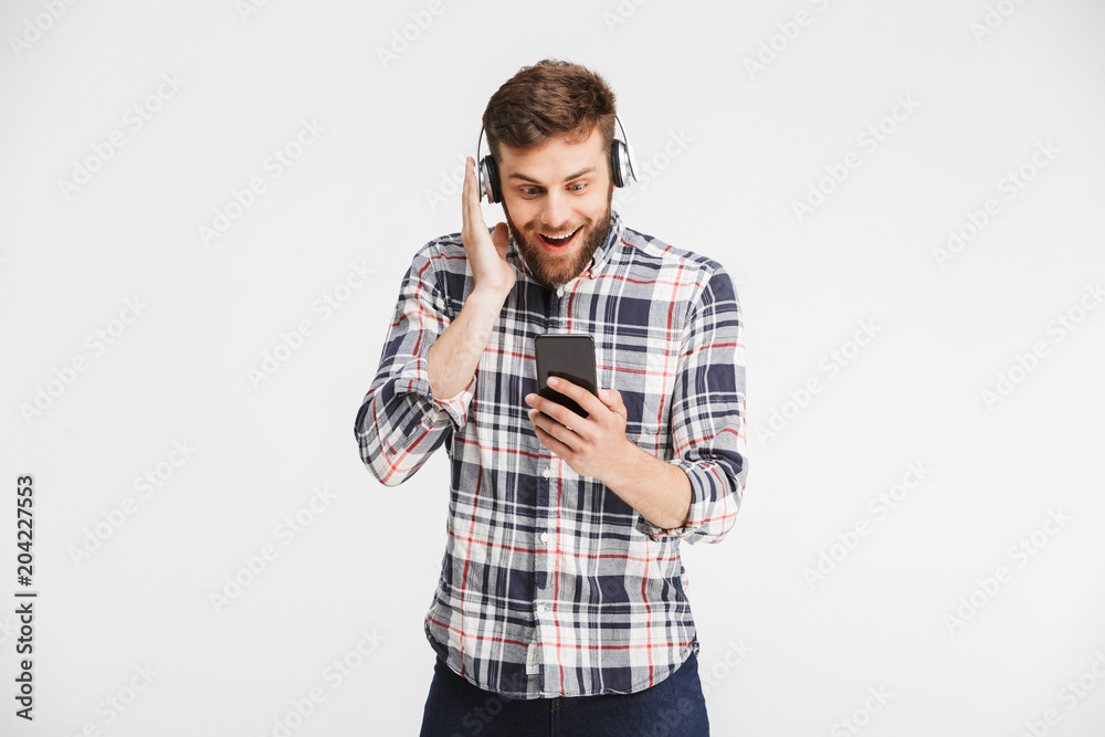 Portrait of a happy young man in plaid shirt Portrait of a happy young man in plaid shirt