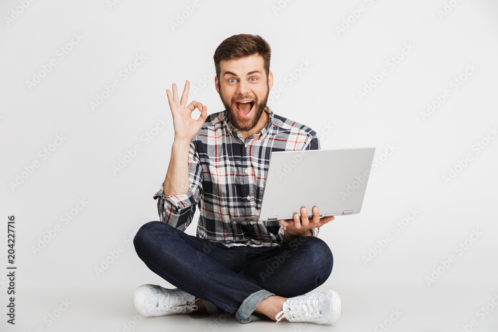 Portrait of a smiling young man in plaid shirt Portrait of a smiling young man in plaid shirt
