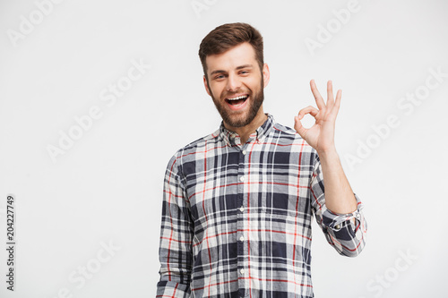 Portrait of a cheerful young man in plaid shirt