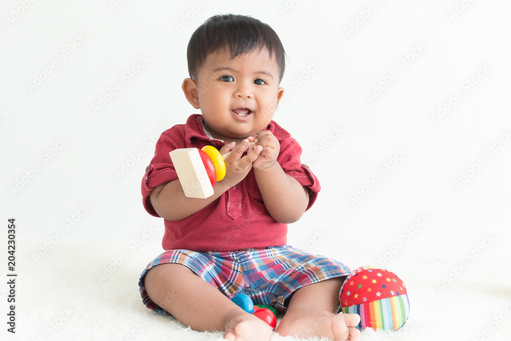 Cute asian little boy play wooden toys Cute asian little boy play wooden toys