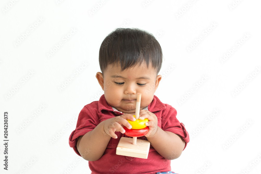 Cute asian little boy play wooden toys Cute asian little boy play wooden toys