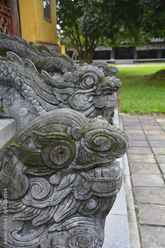 The slithering dragons which divide the steps to the Hien Lam Pavilion in the Imperial City, Hue, Vietnam
