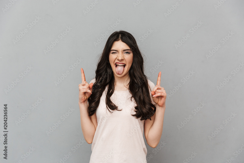 Emotional beautiful young lady pointing. Emotional beautiful young lady pointing.
