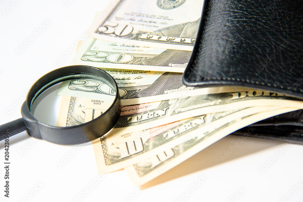 Money, hundred american dollars in black leather purse on white background Money, hundred american dollars in black leather purse on white background