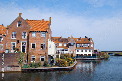 Monumental houses at quay in Enkhuizen, the Netherlands.