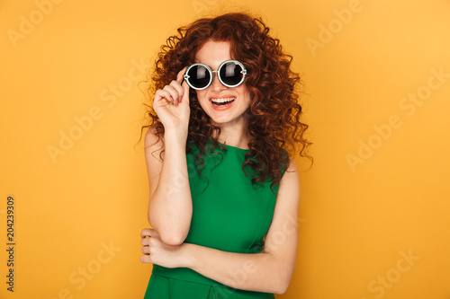 Portrait of a happy redhead woman in dress