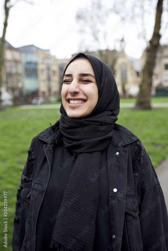 Portrait of a female Muslim student in a city street Portrait of a female Muslim student in a city street