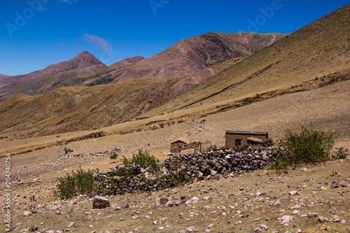 View of Iruya village and multicolored mountains in the surroundings at sunset, Salta province, Argentina, iruya - San Isidro - San Juan treeking photo