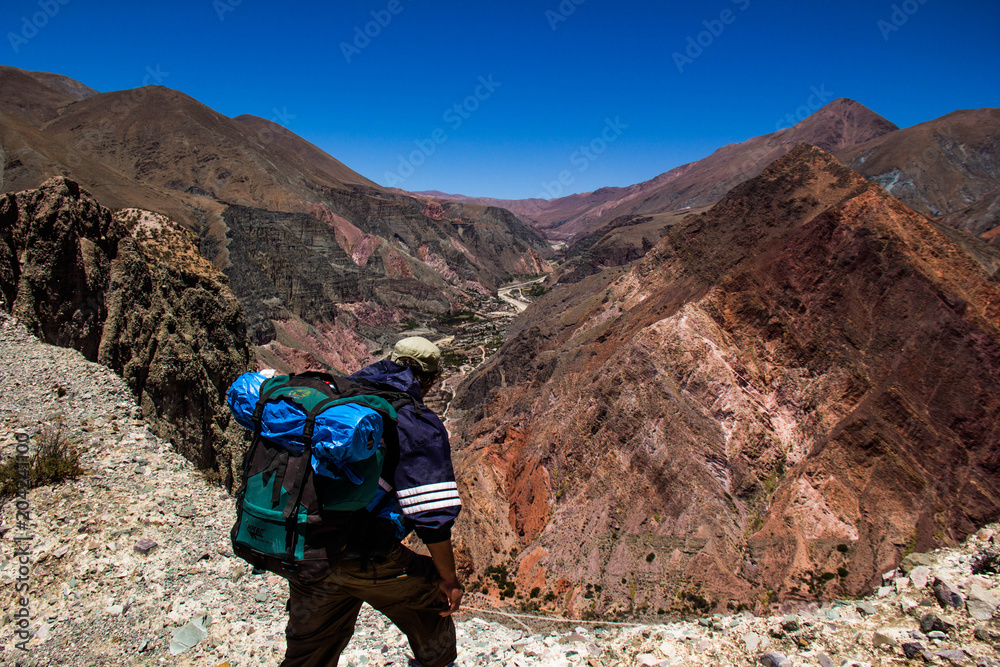 View of Iruya village and multicolored mountains in the surroundings at sunset, Salta province, Argentina, iruya - San Isidro - San Juan treeking