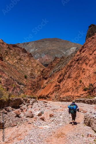 View of Iruya village and multicolored mountains in the surroundings at sunset, Salta province, Argentina, iruya - San Isidro - San Juan treeking