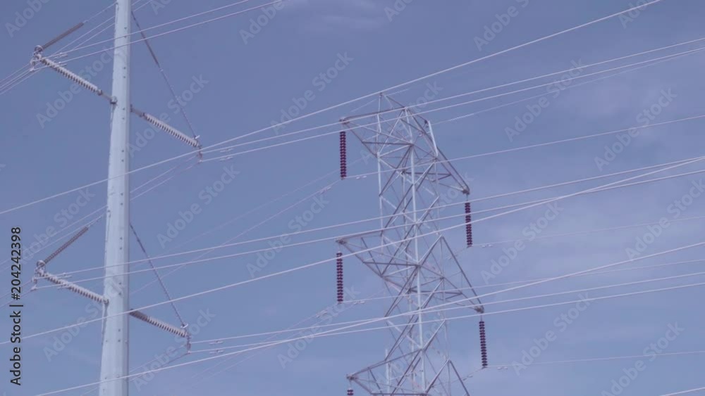 Big towers with power lines in suburban neighborhood