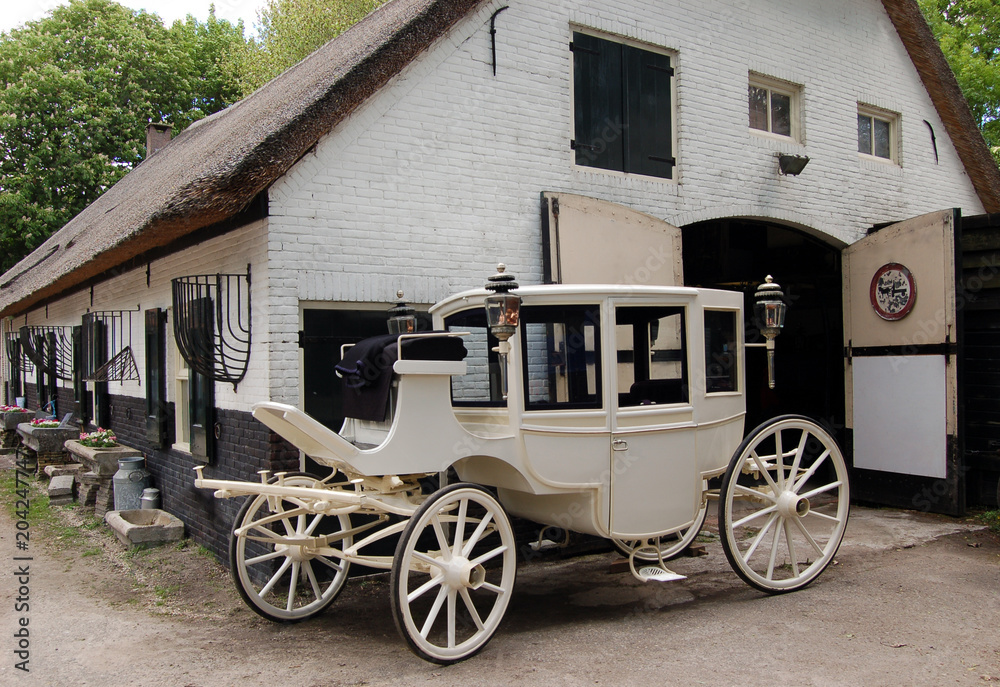 White old-fashioned carriage for a farm.