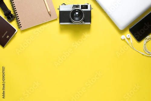Top view of Traveler's accessories on yellow backgroung, Travel concept background