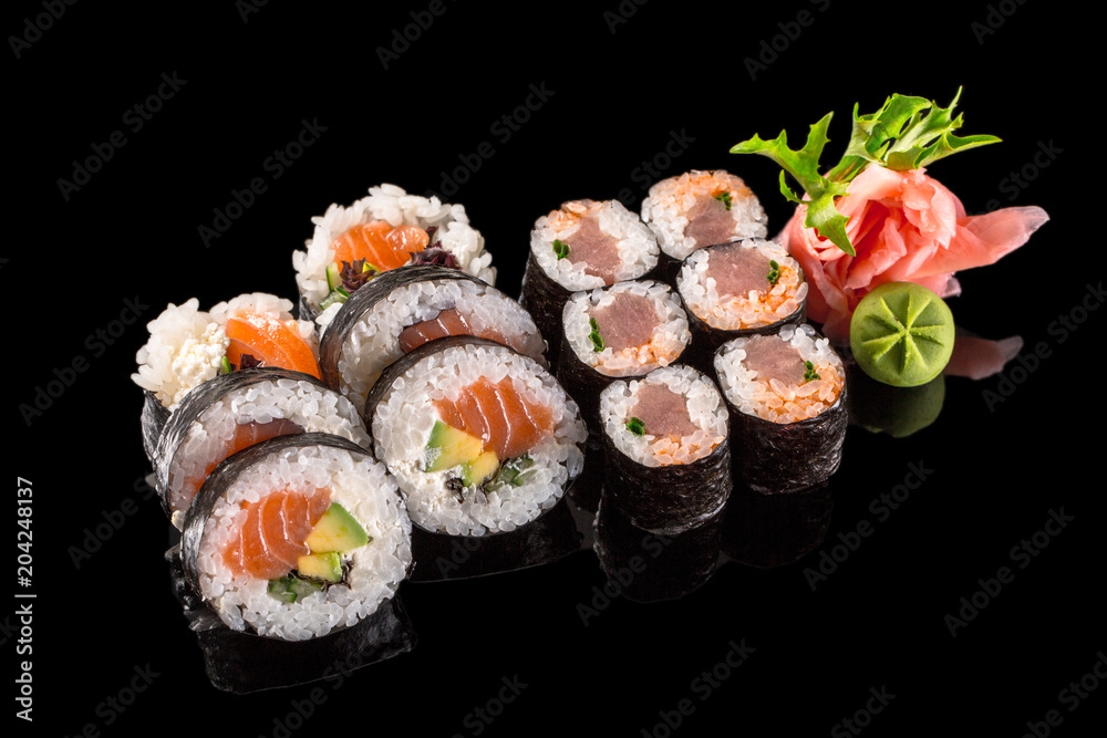 sushi rolls isolated on the black background sushi rolls isolated on the black background