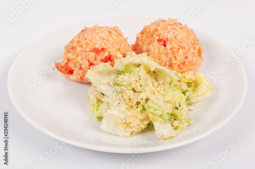 Tomato rice and salad on a white