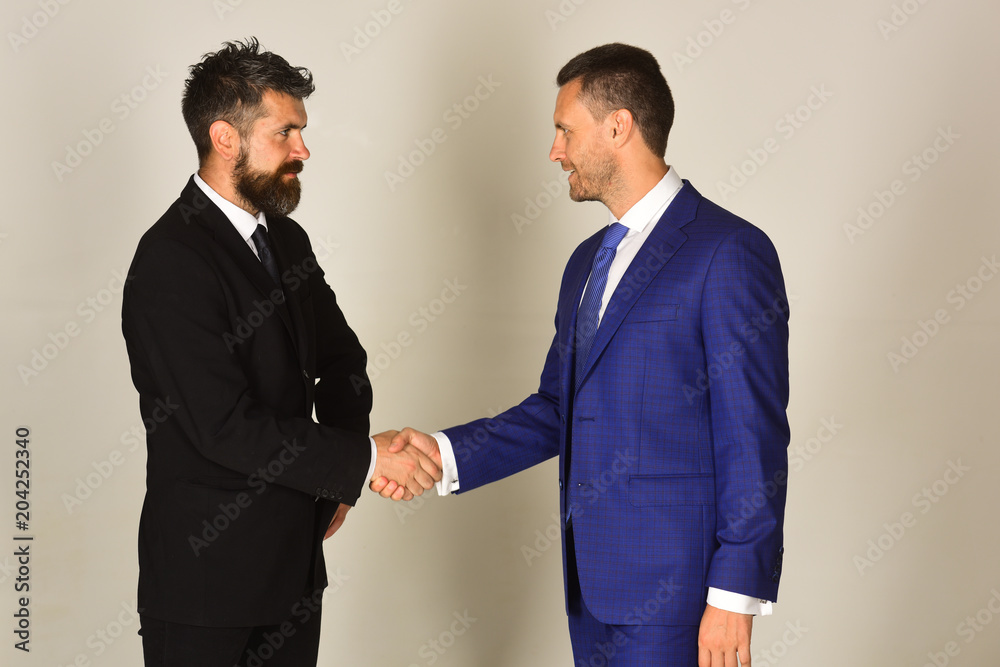 Businessmen wear smart suits and ties. Business agreement and compromise Businessmen wear smart suits and ties. Business agreement and compromise