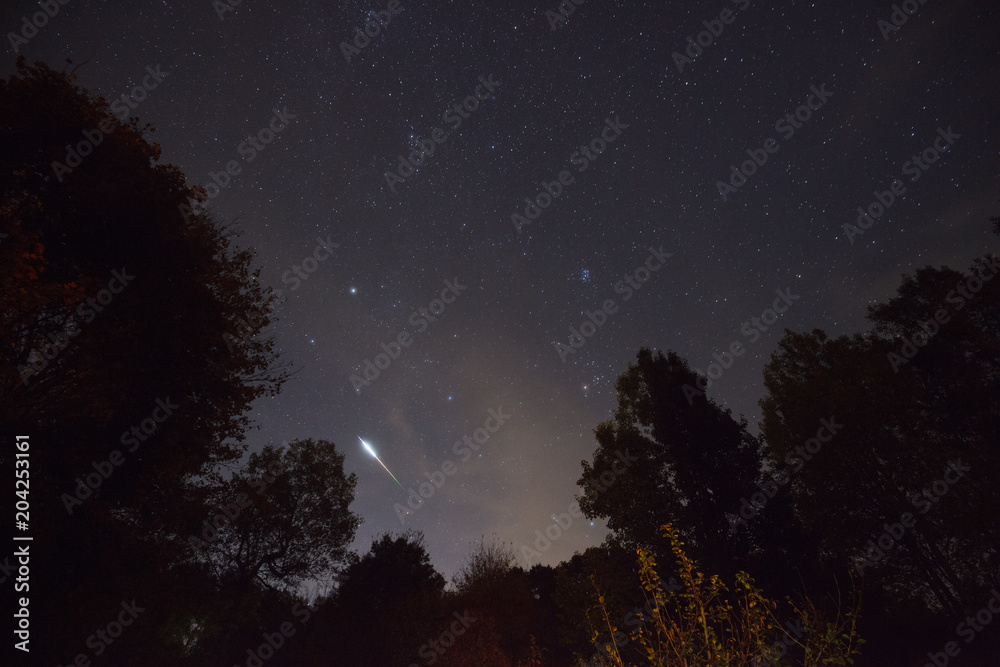 Meteor in Night Sky with Stars