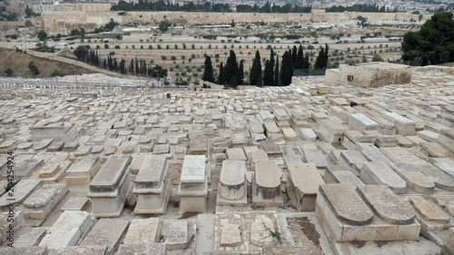 Estebleshing shot of Jerusalem's Jewish Cemetery on the Mount of Olives and up to the Dome of the rock.