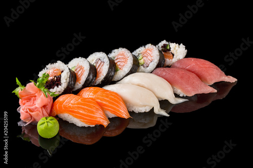 Sushi set isolated on the black background.
