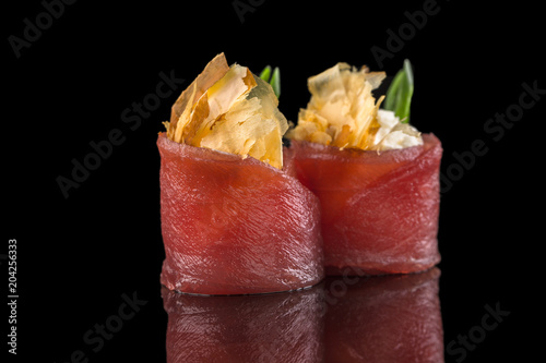 Tuna sushi isolated on the black background.