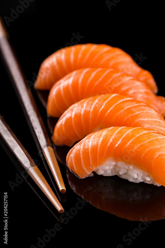 salmon nigiri sushi on the black background
