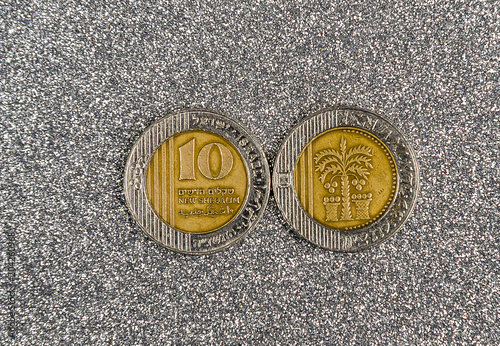 10 Israeli New Sheqel coin on gray background photo