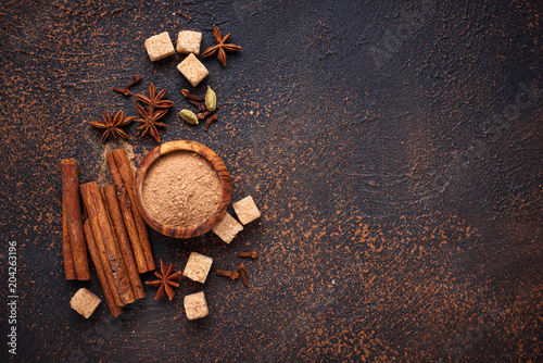 Fototapeta Naklejka Na Ścianę i Meble -  Cinnamon, anise, cardamom, clover and sugar