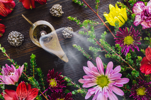 Burning Incense with Summer Flowers photo