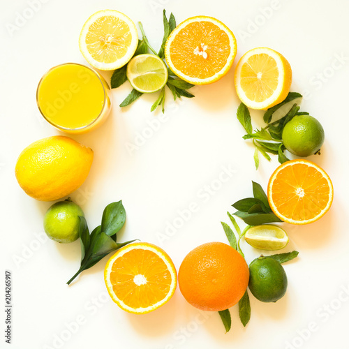 Summer set of tropical fruits, lemon, orange and green leaves on white. Banner.