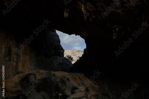 Ruins of Tiscali Village, an archaeological site (cave) in Sardinia, Dorgali photo