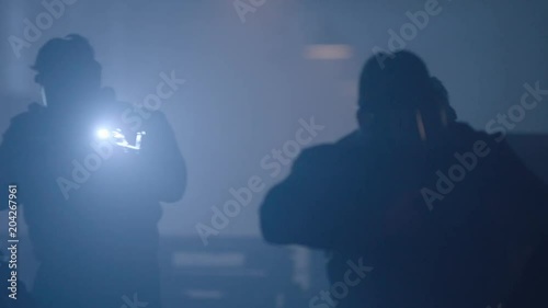 People in gas masks and with weapons. Terrorist and terrorism