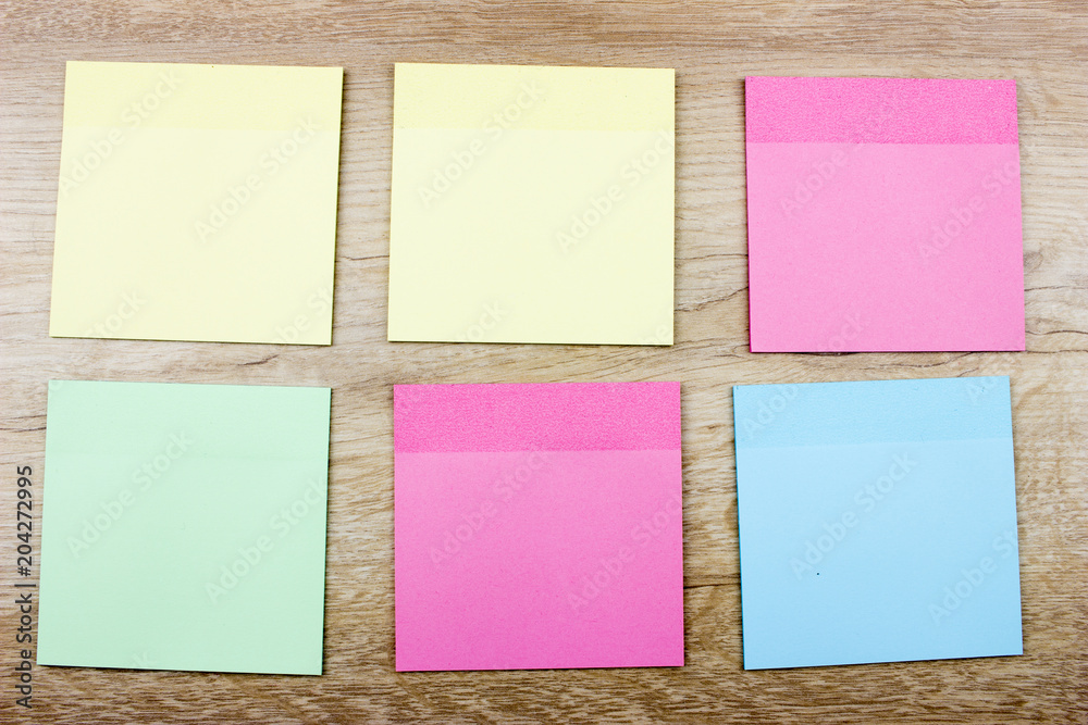Color empty office stickers On wooden table Color empty office stickers On wooden table