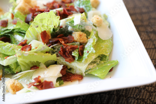 Caesar salad , vegetable with bread bacon and cheese